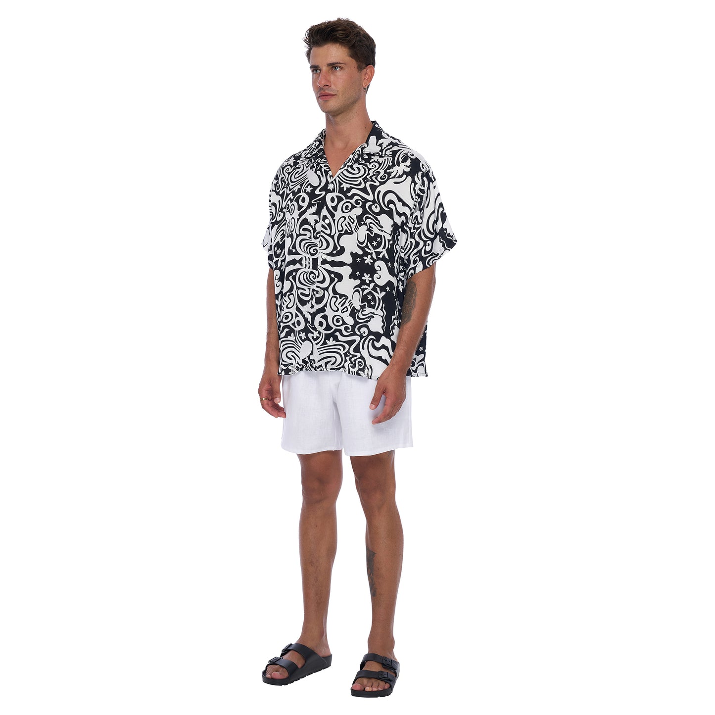 Side View: Kaya Men's Satin Shirt in Black and White abstract print - Relaxed fit shirt made from EcoVero Satin Fabric offering a stylish , sustainable design.