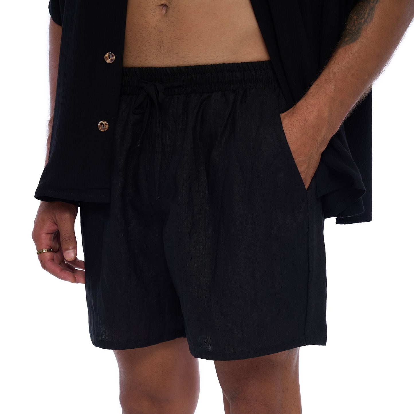 Close up of Leo Men's Shirt in Black Rayon Crinkle fabric - Detailed view of soft, textured fabric and stylish Shell buttons